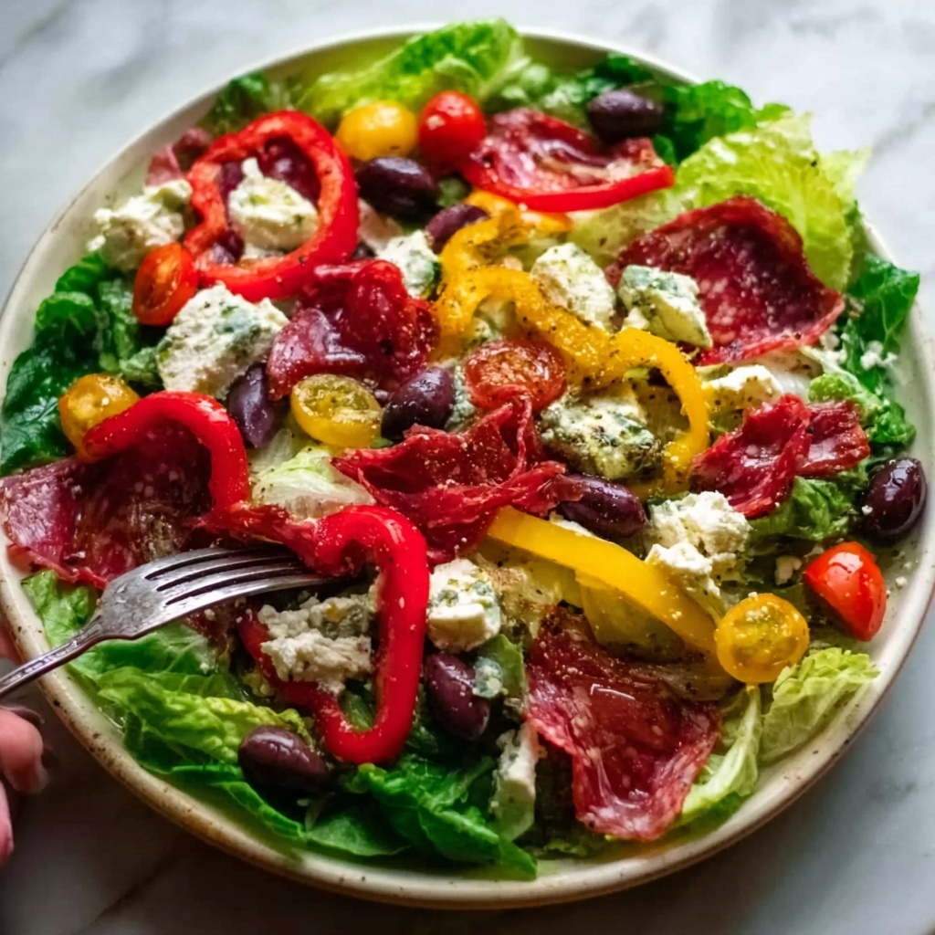 Classic Italian Salad with Mozzarella, Salami, and Vegetables Recipe - Recipe Image